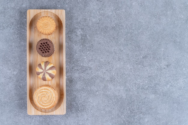 A small tray with cookies on marble