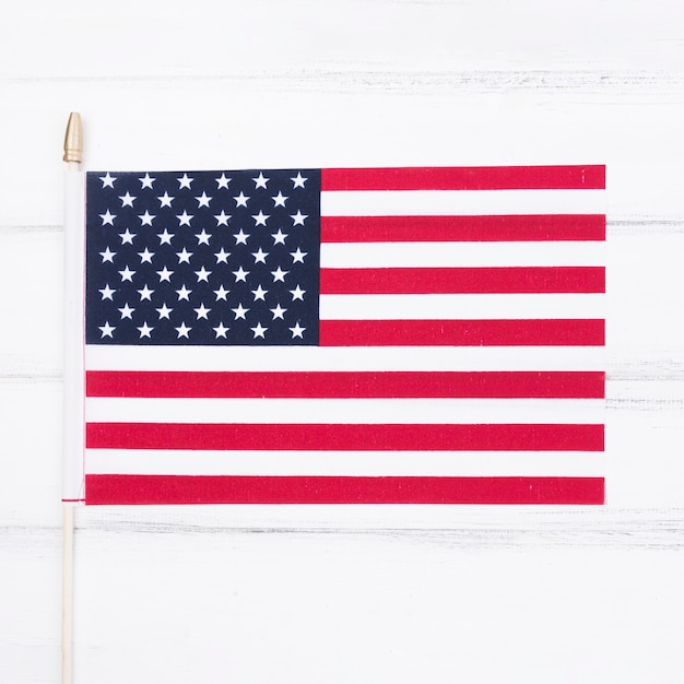 Small USA flag on white table 