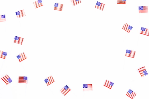 Free Photo small usa flags scattered on white background 