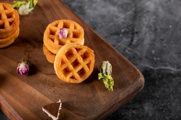 Small waffles on a wooden board