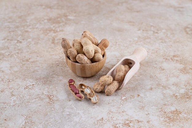 A small wooden bowl full of healthy walnuts.