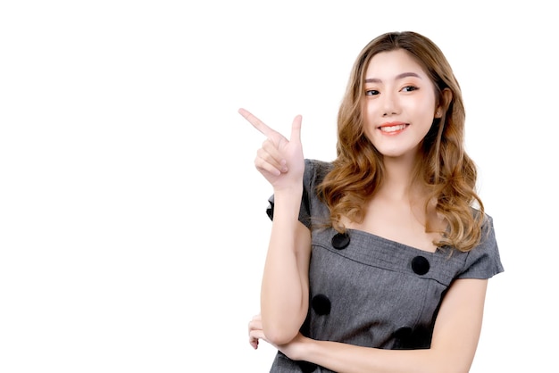 Free photo smart attractive female asian hand gesture point to copy sapce with happiness and joyful hand present template card with smile business ideas concept