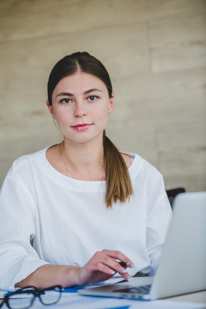 Smart businesswoman with laptop