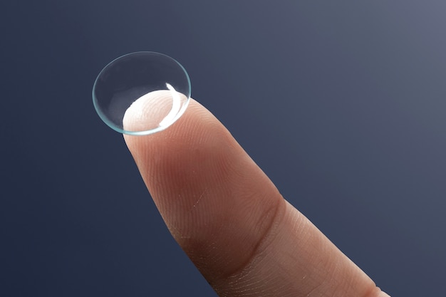 Free photo smart contact lens on fingertip new tech