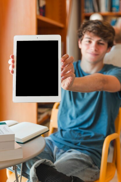Smart man showing tablet