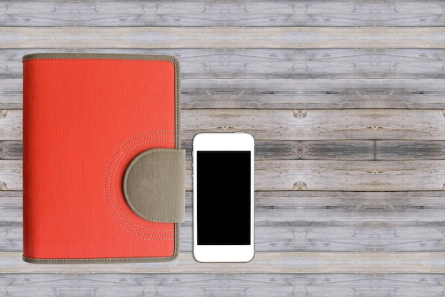 Smart phone on a wooden table