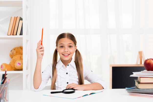 Free photo smart schoolgirl having idea