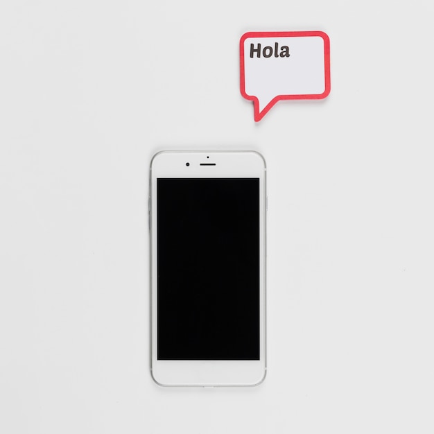 Free photo smartphone and frame with hola inscription