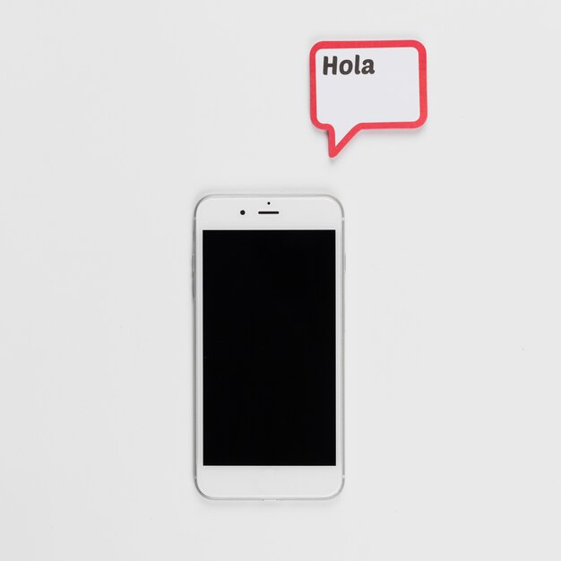 Smartphone and frame with Hola inscription