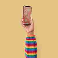 Free photo smartphone isolated in studio with hand raised