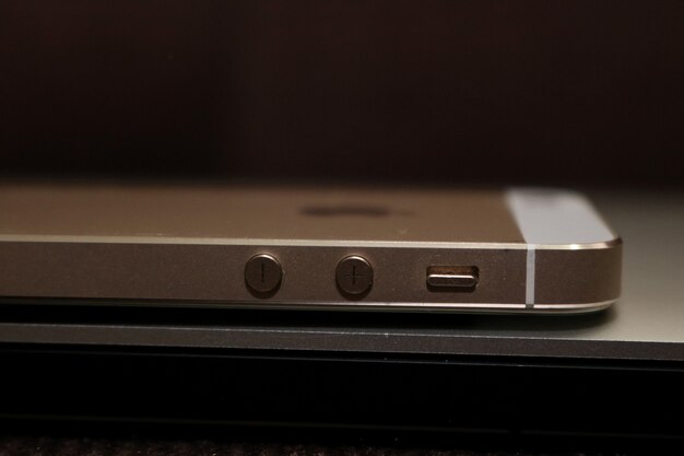 Smartphone on laptop side view