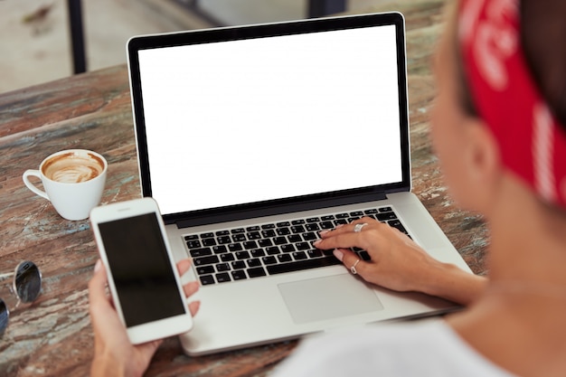 Smartphone and laptop with blank screens