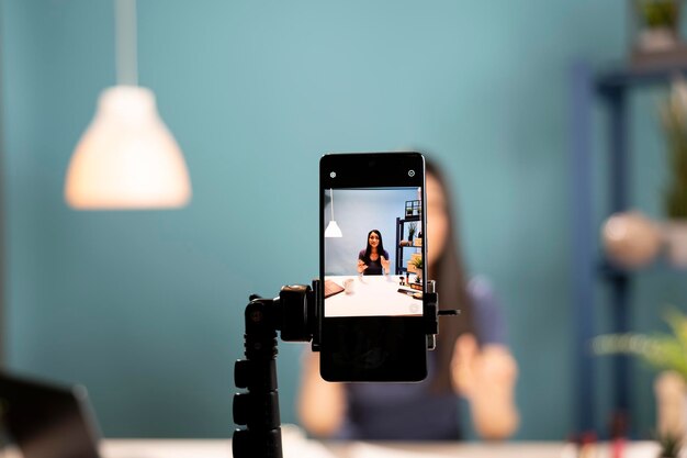smartphone recording a beauty influencer