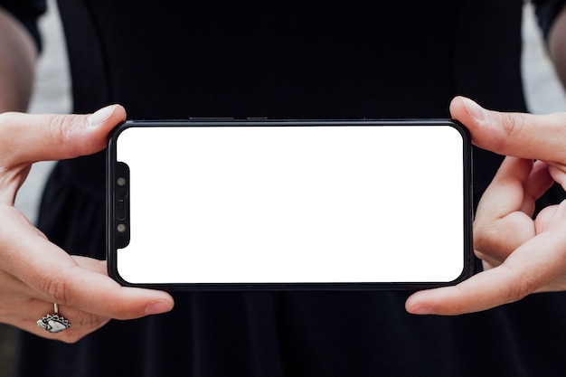 Free photo smartphone screen hold by a person