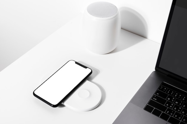 Smartphone on white wireless charger pad