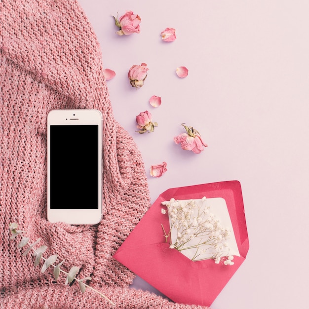 Smartphone with flowers in envelope 