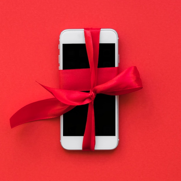 Smartphone with red ribbon