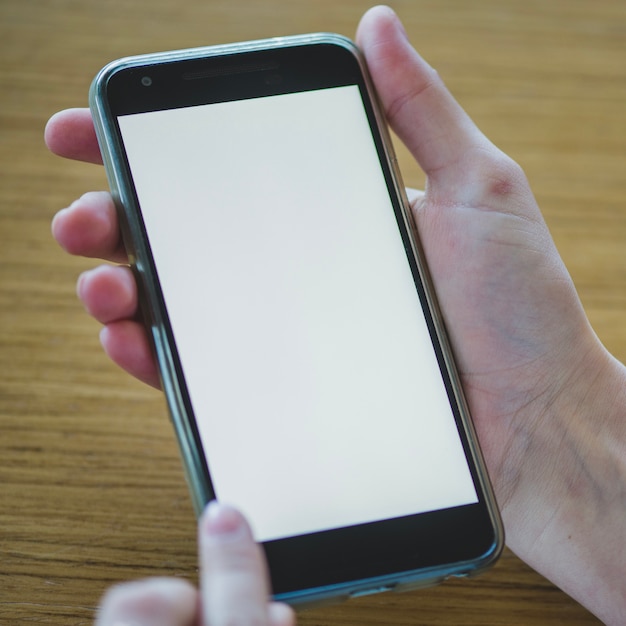 Smartphone on wooden background