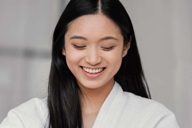 Smiley asian woman at home