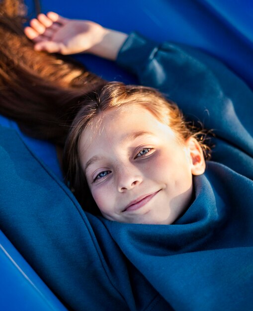 Smiley beautiful little girl at the playground