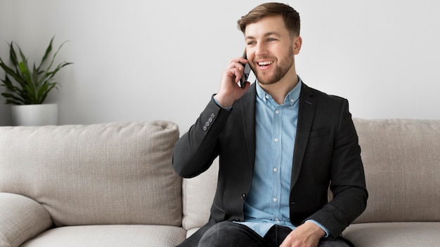 Smiley business man talking over phone