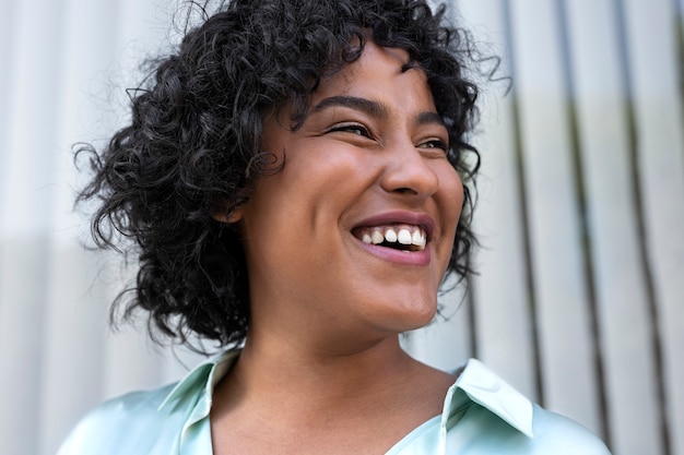 Free photo smiley business woman portrait side view