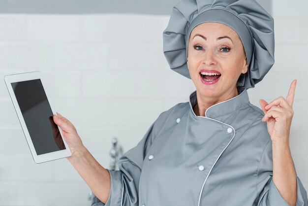 Smiley chef with tablet