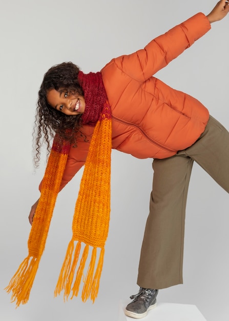 Free photo smiley child wearing warm clothes