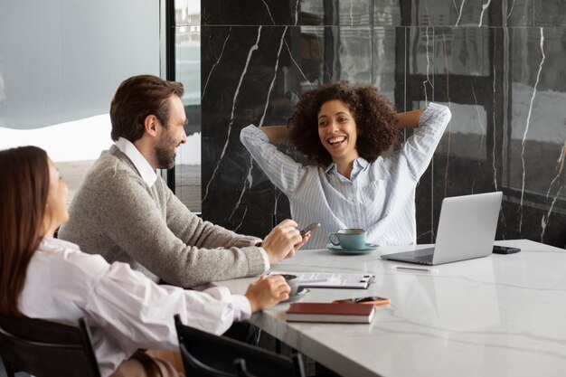 Smiley colleagues discussing during break time