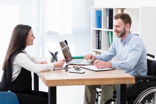 Smiley colleagues discussing