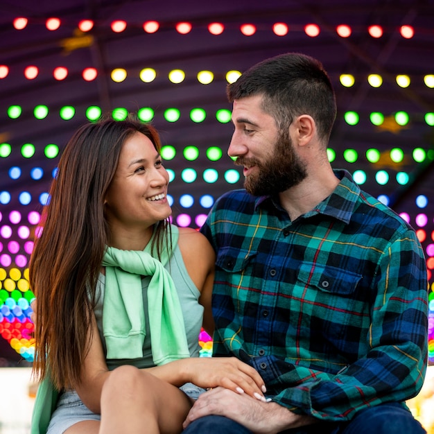 Smiley couple at the amusement park