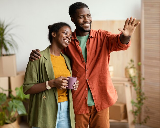 Smiley couple planning on redecorating house