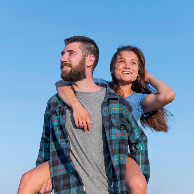 Smiley couple posing together outdoors