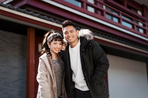 smiley couple posing together outdoors