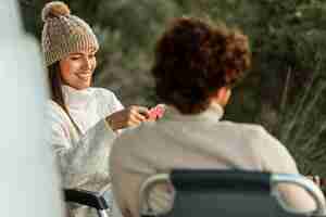 Free photo smiley couple relaxing together while on a road trip