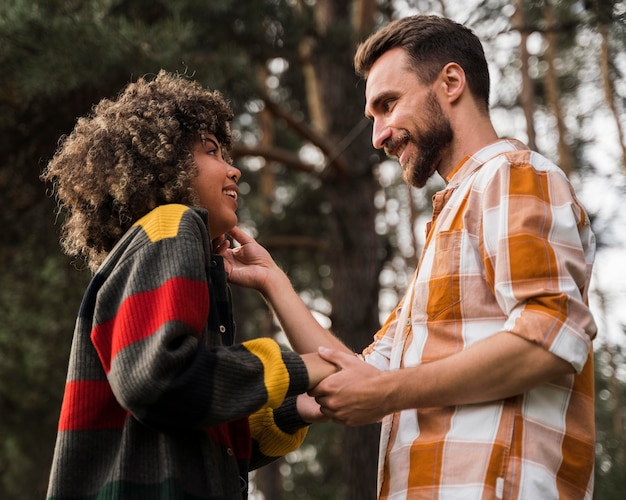 Smiley couple spending time together outdoors