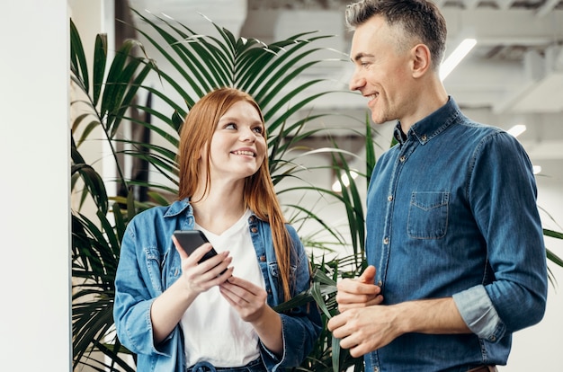 Smiley coworkers looking at each other