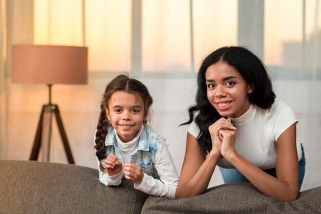 Smiley daughter and mom spending time together