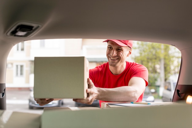 Smiley delivery man working