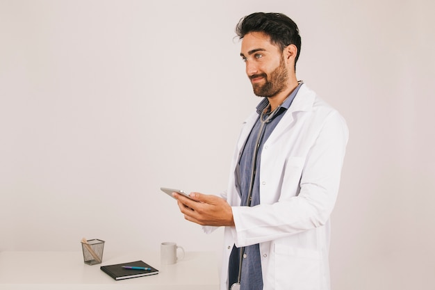 Smiley doctor posing with the ipad