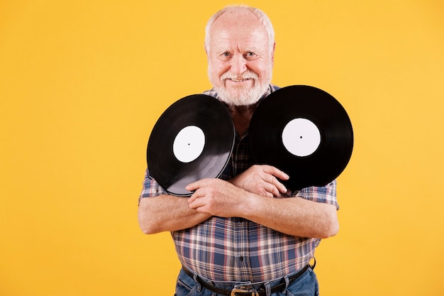 Smiley elder with music records