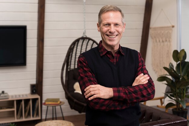 Smiley father posing with arms crossed