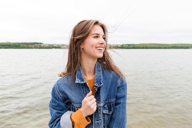 Smiley female enjoying sea breeze