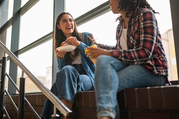 Smiley female friends conversing