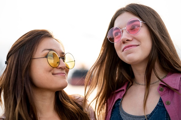 Smiley female friends with sunglasses