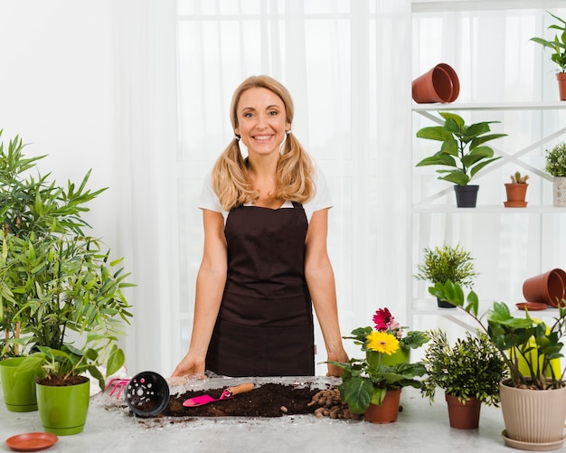 Smiley female in greenhouse