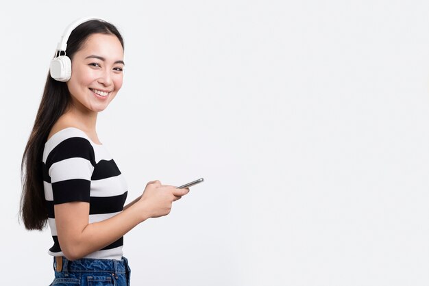 Smiley female listening music