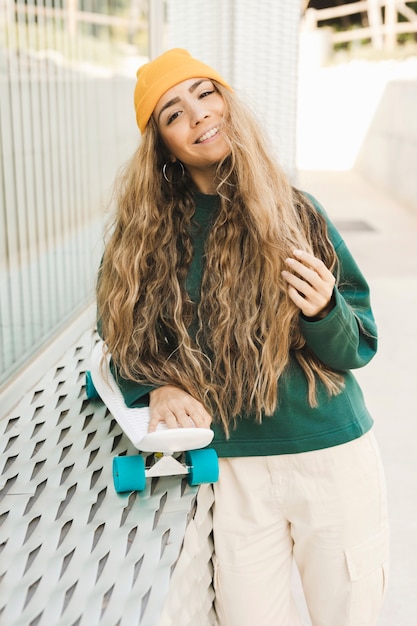 Smiley female with skateboard