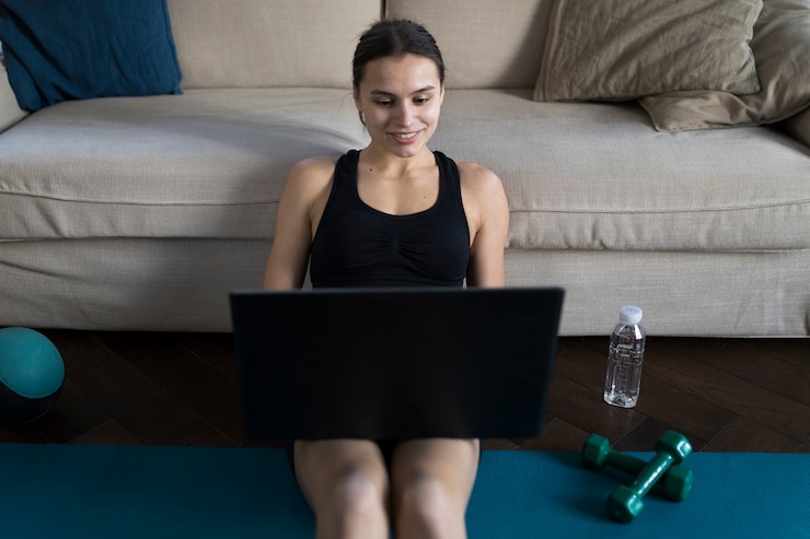Free Photo smiley female working on laptop