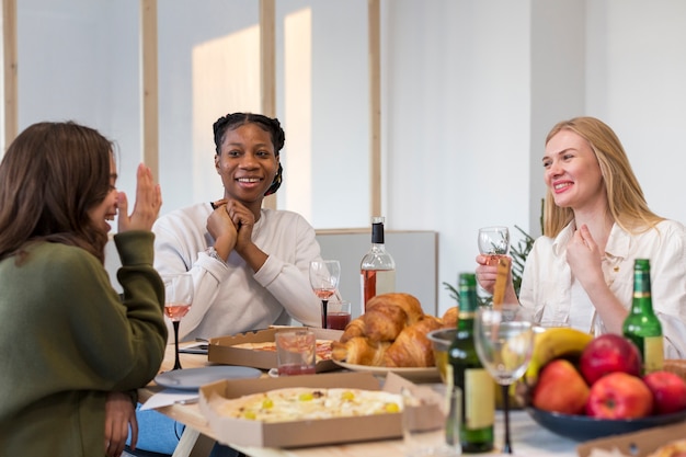 smiley females eating together